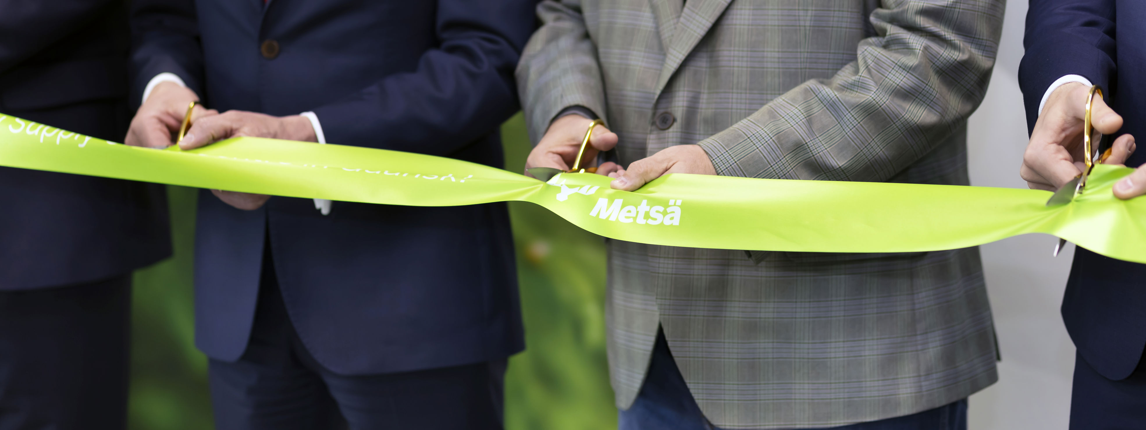 Close up of ribbon cutting