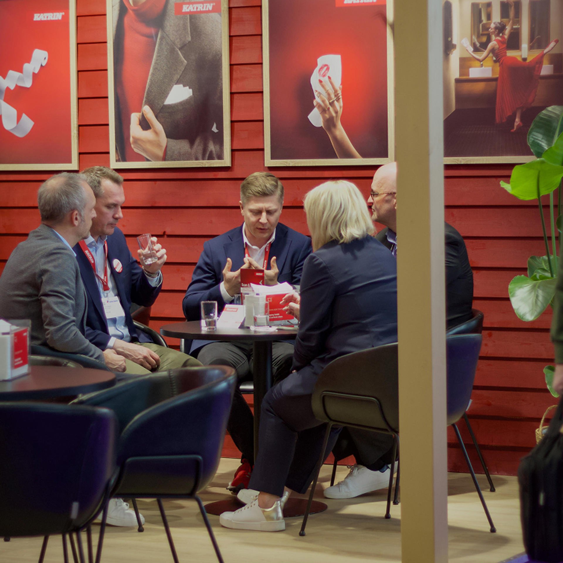 Visitors in conversation in the company's lounge area during Interclean Amsterdam 2026