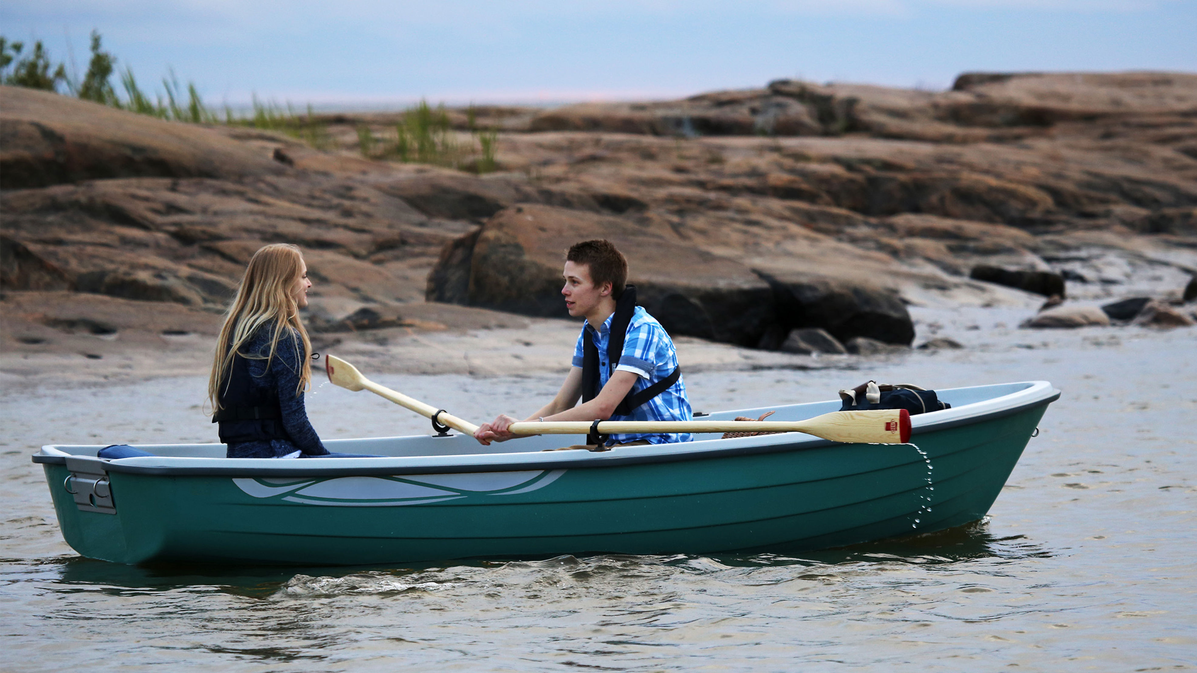 People on a rowing boat