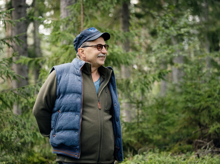 Raimo, a forest owner, photographed in the forest.