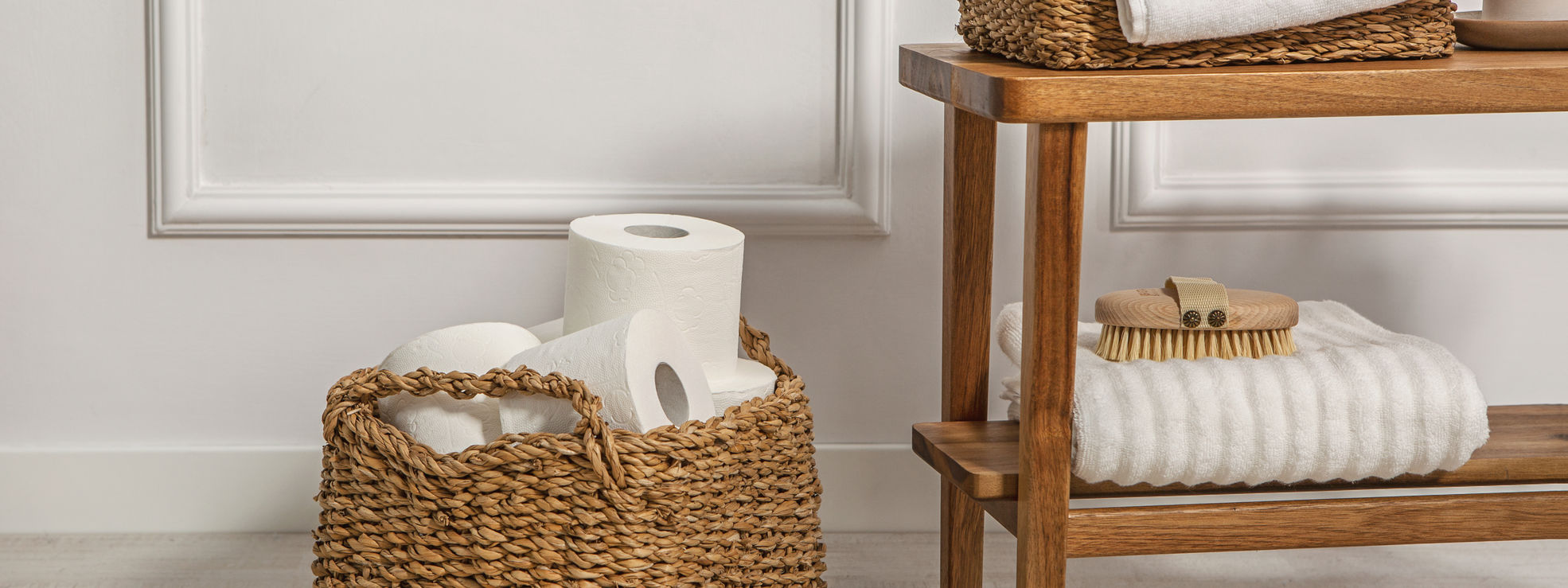 white toilet paper rolls in a basket
